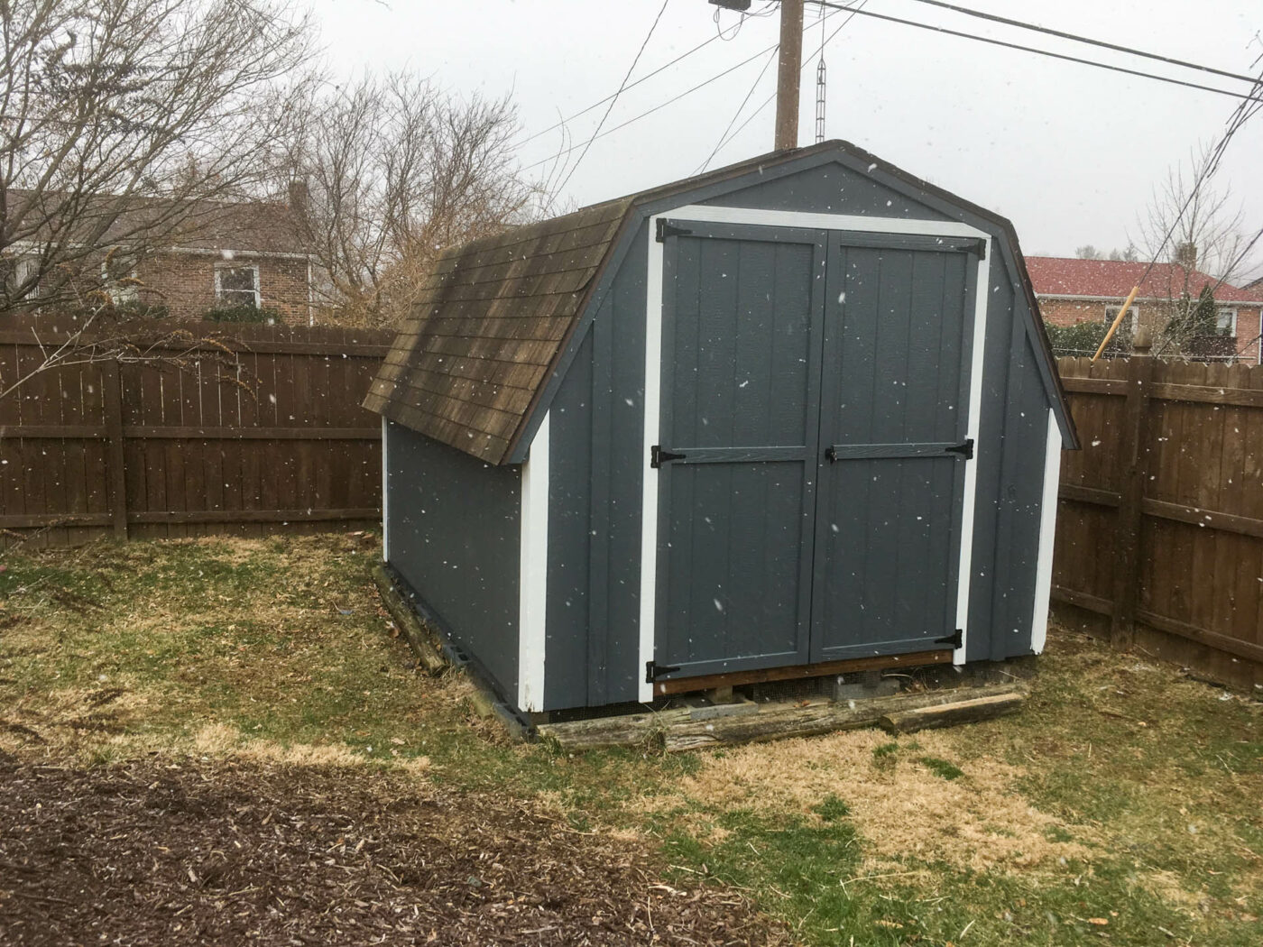 shed repair in bellefonte pa- green shed in the snow