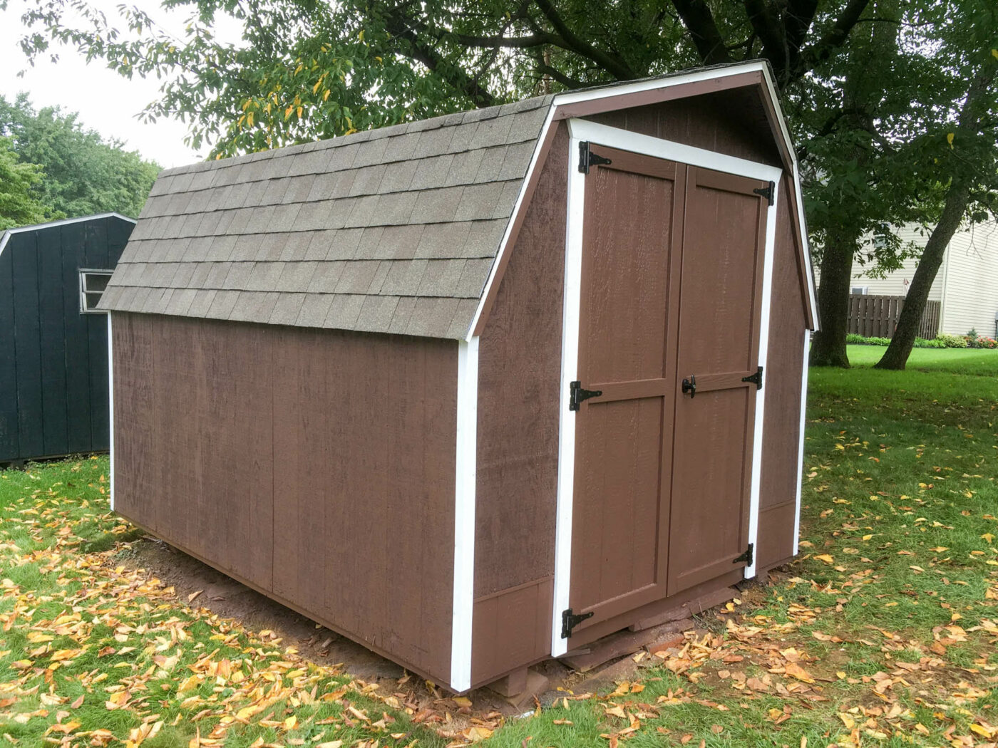 Rood and siding shed repair on brown shed in bellefonte pa