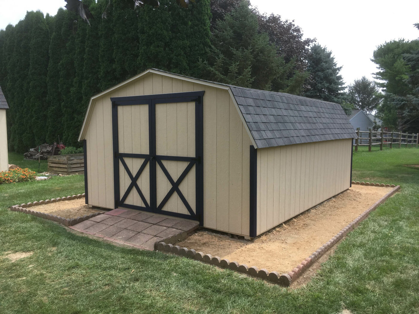 shed repair in jersey shore pa- shed with tan siding and brown trim